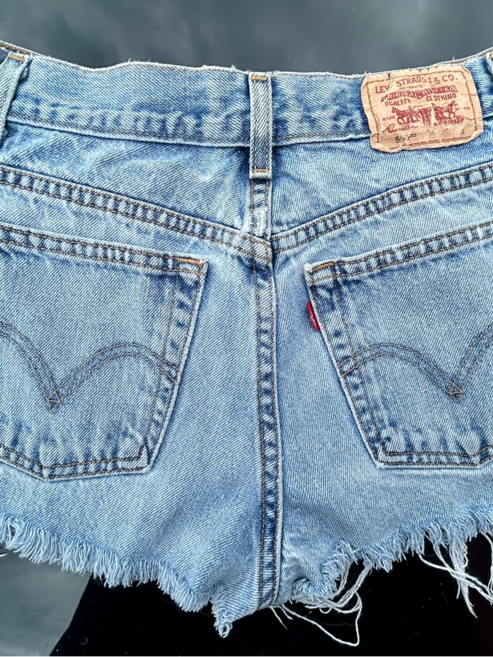 Vintage late 1980’s Levi’s 550 Frayed Cut-off high waist denim shorts. Size 8